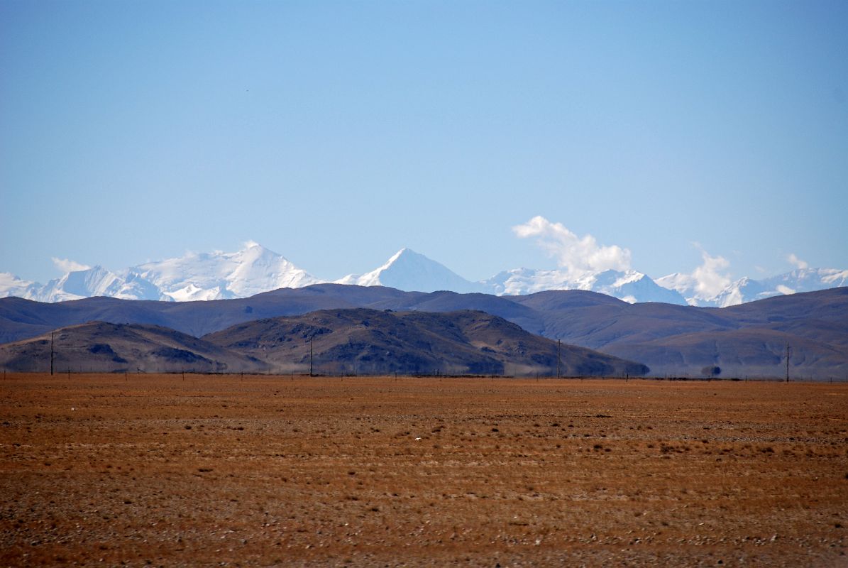 31 Annapurna III and Gangapurna From Just After Old Zhongba Tibet Just after leaving Old Zhongba on the way to Mount Kailash, the mountain panorama to the south includes Annapurna III, the broad white mountain to the left, and Gangapurna, the pointed peak in the middle mostly in shadow.